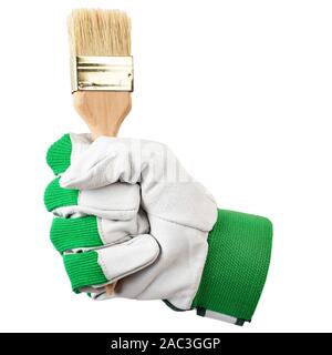 a paint brush in the hand of a worker, in a work glove. isolated on a white background. file contains clipping path Stock Photo