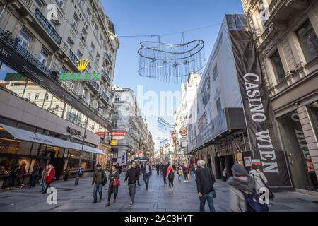 VIENNA, AUSTRIA - NOVEMBER 6, 2019: Panorama of Karntner street with people shopping in stores around. Karntnerstrasse is the main pedestrian street o Stock Photo