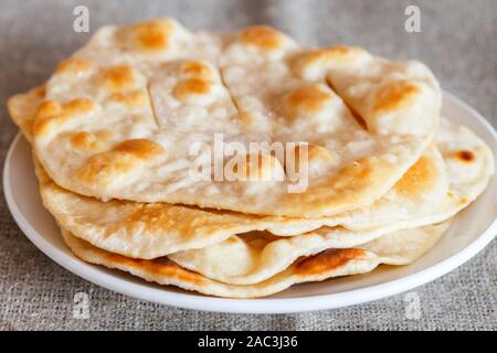 Home fried water-bisquits on white table, on canvas. Rustic style. Blurred background. Stock Photo