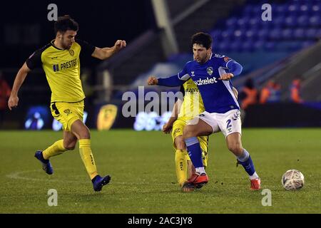 Oldham, UK. 30th Nov, 2019. OLDHAM, ENGLAND - NOVEMBER 30TH Oldham's Zak Mills and Burton Albion's Liam Boyce in action during the FA Cup 2nd Round match between Oldham Athletic and Burton Albion at Boundary Park, Oldham on Saturday 30th November 2019. (Credit: Eddie Garvey | MI News) Photograph may only be used for newspaper and/or magazine editorial purposes, license required for commercial use Credit: MI News & Sport /Alamy Live News Stock Photo