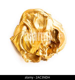 Gold acrylic paste on white background Stock Photo