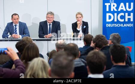 Brunswick, Germany. 30th Nov, 2019. Tino Chrupalla (l) and Jörg Meuthen, newly elected federal spokespersons of the AfD, and Alice Weidel, faction leader of the AfD parliamentary group, are sitting at a press conference at the AfD party conference. Credit: Hauke-Christian Dittrich/dpa/Alamy Live News Stock Photo