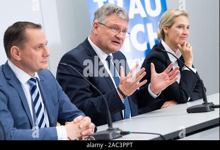 Brunswick, Germany. 30th Nov, 2019. Jörg Meuthen (M) and Tino Chrupalla, newly elected federal spokespersons of the AfD, and Alice Weidel, parliamentary group chairmen of the AfD parliamentary group, are sitting at a press conference at the AfD party conference. Credit: Sina Schuldt/dpa/Alamy Live News Stock Photo