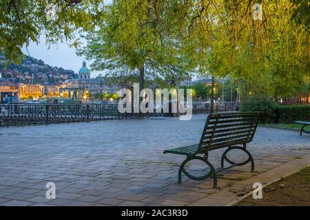 Como - The city with the Cathedral and harbor from the promenade in the morning dusk. Stock Photo