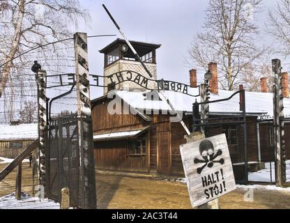 A view on the sign 'Halt' ('Stop') near the entrance to the Auschwitz I German Nazi concentration and extermination camp, with the motto 'Arbeit macht frei' ('Work brings freedom') over the main gateway. In two months, the 75th anniversary of the liberation of Auschwitz. The biggest German Nazi concentration and extermination camp KL Auschwitz-Birkenau was liberated by the Red Army on 27 January 1945. Stock Photo