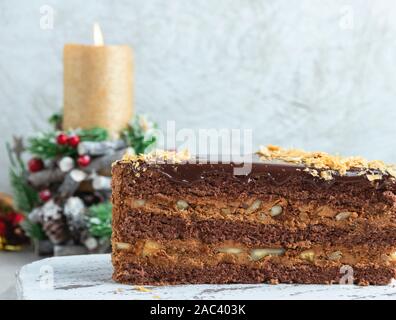 sponge cake with nuts and chocolate, caramel layers Stock Photo