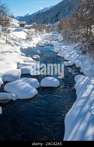 Panoramic view of a snowy creek on a sunny day. Val Ridanna, South Tyrol, Italy Stock Photo