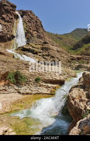 Wadi Dharbat Waterfalls from lower Canyon Stock Photo