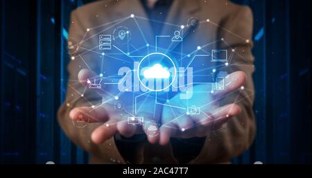 Man holding hologram projection displaying cloud technology symbols Stock Photo