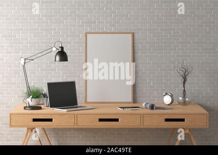 Workspace with vertical poster mock up on the desk. Desk with drawers in interior of the studio or at home with white brick wall. Clipping path around Stock Photo