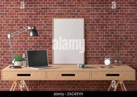 Workspace with vertical poster mock up on the desk. Desk with drawers in interior of the studio or at home with red brick wall. Clipping path around p Stock Photo