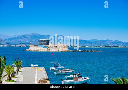 Panoramic view from the waterfront of the coastal city of Nafplio. Beautiful Spring colors around the picturesque port of Nafplio city, Greece Stock Photo