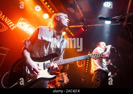 Edinburgh, Scotland. 30th November 2019. London band Childcare perform at iconic Edinburgh venue Sneaky Pete’s as part of a UK tour promoting their debut album 'Wabi-Sabi' Founded by Ed Cares (vocals), Childcare are Emma Topolski (bass), Rich Legate (guitar) and Glyn Daniels (drums). Stock Photo