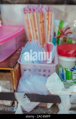 Plastic cutlery and bamboo sticks in Asia Stock Photo