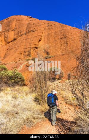 A male hiker along the Valley of the Winds walk in the Olgas. Kata Tjuta, Northern Territory, Australia Stock Photo