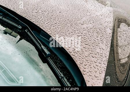 Clean car windshield with multiple water drops on after heavy rain and dew water  repellent surface treatment Stock Photo - Alamy