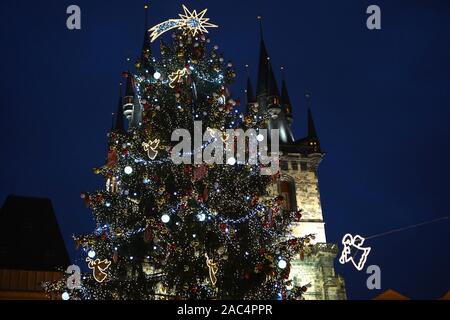 Prague, Czech Republic. 30th Nov, 2019. The Christmas tree is lit up in Prague, the Czech Republic, Nov. 30, 2019. With the lightening ceremony of the 22-meter-high Christmas tree Saturday evening on the Old Town Square in downtown Prague, the traditional Christmas market officially opened. Credit: Dana Kesnerova/Xinhua/Alamy Live News Stock Photo