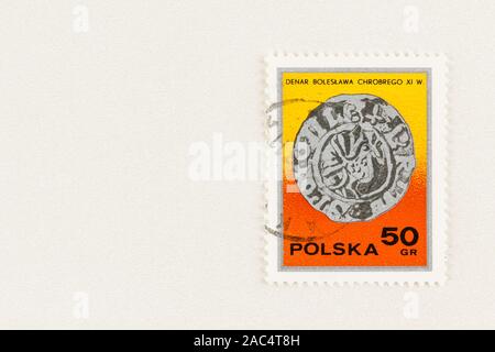 SEATTLE WASHINGTON - October 9, 2019: Polish postage stamp with early 11th century denar coin, imprinted with Princes Polonie. Stock Photo