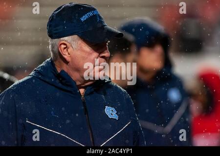 Raleigh, North Carolina, USA. 30th Nov, 2019. Nov. 30, 2019 - Raleigh, North Carolina, USA - North Carolina Tar Heels head coach Mack Brown watches his Tar Heels warm-up before Saturday's game between the NC State Wolfpack and University of North Carolina Tar Heels. The Tar Heels defeated the Wolfpack, 41-10. Credit: Timothy L. Hale/ZUMA Wire/Alamy Live News Stock Photo