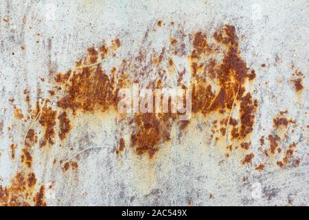 White corroded metal background. Rusty and scratched painted metal wall. Rusty metal background with streaks of rust . Stock Photo