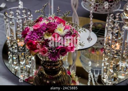 Flowers and Candles for catering & decor purposes at corporate Christmas Gala Event Party Stock Photo