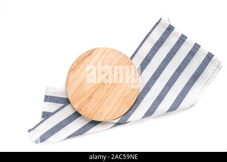 Empty wooden platter with blue napkin isolated on white background, top view, copy space. Wooden cutting board for pizza, design element. Stock Photo