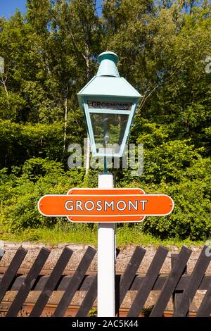 A close up of a traditional light and destination sign at Grosmont Station, on the North Yorkshire Moors Railway. Stock Photo