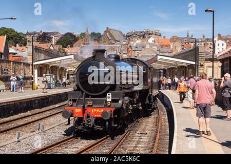 A steam train is pictured in Whitby Station on June 25, 2018, on the North Yorkshire Moors Railway. Stock Photo
