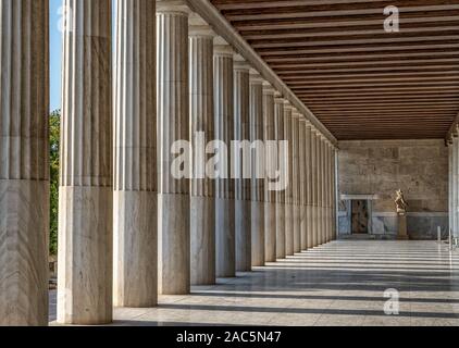 Athens, Greece - August 17, 2019: Ionic columns inside stoa of Attalos, ancient agora of Athens before sunset Stock Photo