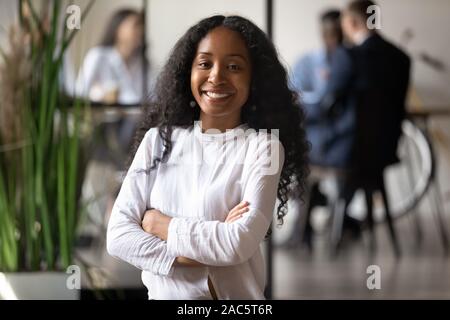 Head shot portrait of smiling young african american female professional. Stock Photo