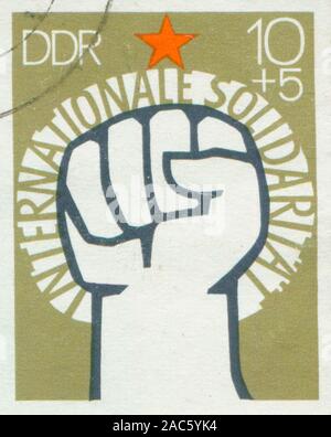 171e GERMANY - CIRCA 1972: A stamp printed in East Germany, showing of International Solidarity of Communists, Stock Photo