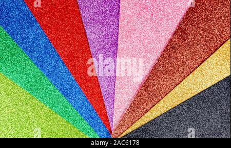 Rainbow sparkles background . Celebration decoration backdrop. Top view, copyspace . Stock Photo