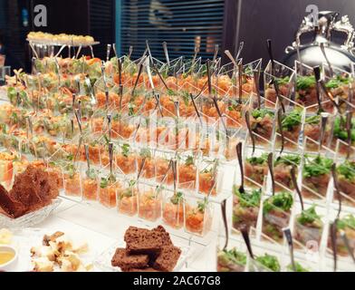 Fish tartare in small glasses, catering event, banquet food, toned Stock Photo