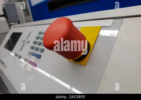Big red round button on the machine, closeup Stock Photo