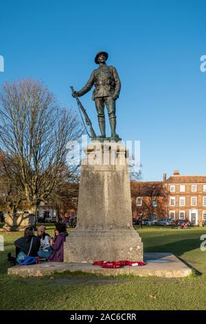 King's Royal Rifle Corps Memorial (soldier statue) outside Winchester Cathedral, Hampshire, England, UK Stock Photo