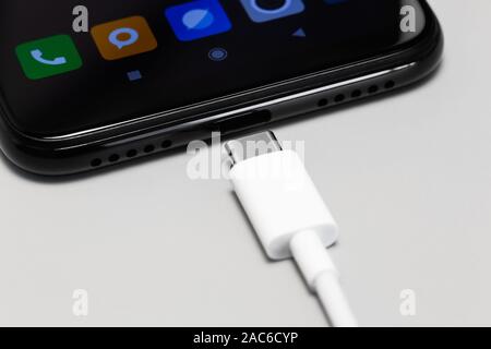 Phone with a USB-C connector and USB type C cord Stock Photo