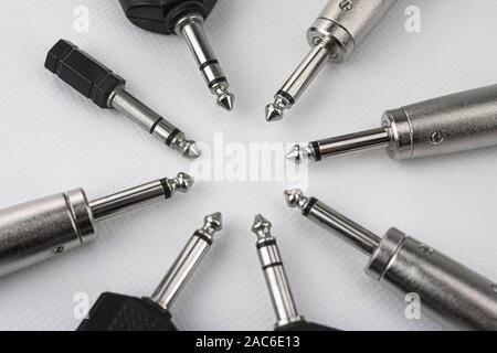 Connectors with mono and stereo jack terminals, and conversion to mini jack, male and female xlr, signal duplicators, etc. on white background Stock Photo