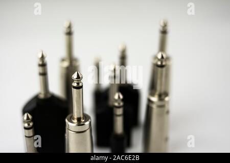 Various audio connectors on white background and in perspective Stock Photo