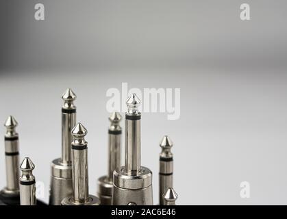 Close-up of jack, mono and stereo audio jack connectors, metallic, in perspective and on white background Stock Photo