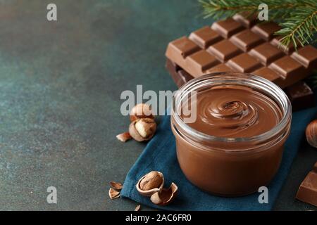 Chocolate spread or nougat cream with hazelnuts in Christmas time Stock Photo