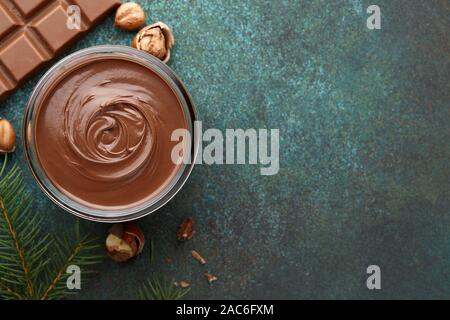 Chocolate spread or nougat cream with hazelnuts in Christmas time Stock Photo