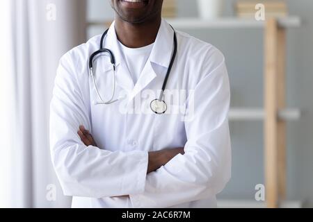 Close up cropped image young smiling professional african american doctor. Stock Photo