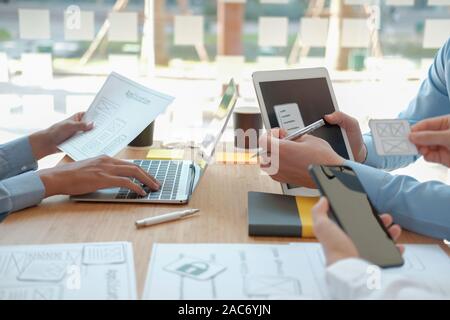 user experience UX designer designing web on smart phone layout. UI planning mobile application. developer work with business prototype Stock Photo