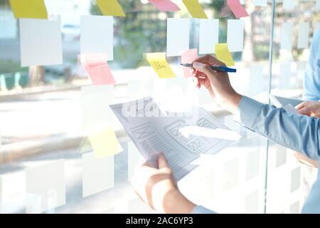 user experience UX designer designing web on smart phone layout. UI planning mobile application. developer work with business prototype Stock Photo