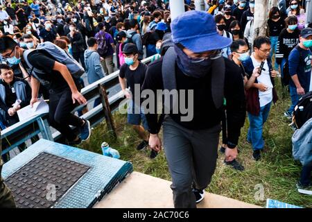 Thousands of Pro-democracy protesters take part in the demonstration.Demonstrations in Hong Kong continue as pro-democracy groups won the District Council elections recently. Protesters continue to call for Hong Kong's government to meet their 5 demands. Stock Photo