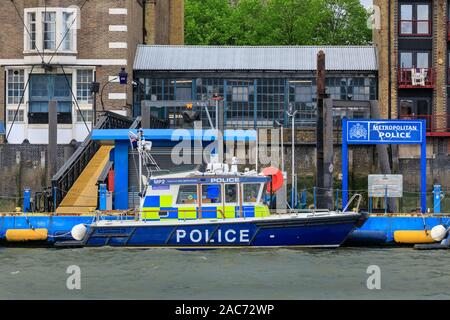 Metropolitan Police Marine Policing Unit, docked boats and jetty in Wapping, London, UK Stock Photo