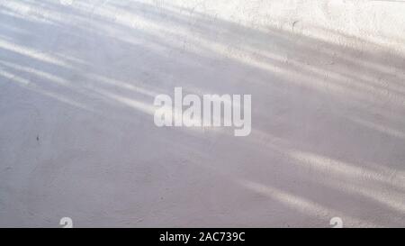 Abstract gray shadow background of natural shading falling on white cement concrete wall texture for background and wallpaper, black and white monochr Stock Photo