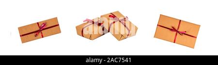 Gift Boxes in Kraft Wrapping Paper with the Red Ribbons isolated Stock Photo