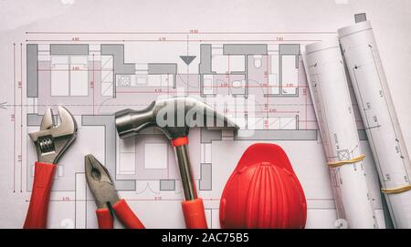 Construction, architect engineer office concept. Hand tools and red hardhat on house project blueprints background top view. Stock Photo