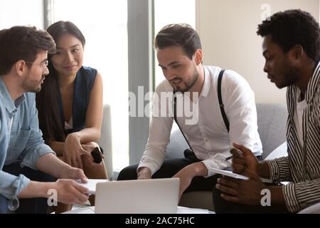 Team of professionals multiethnic company staff working on project together Stock Photo